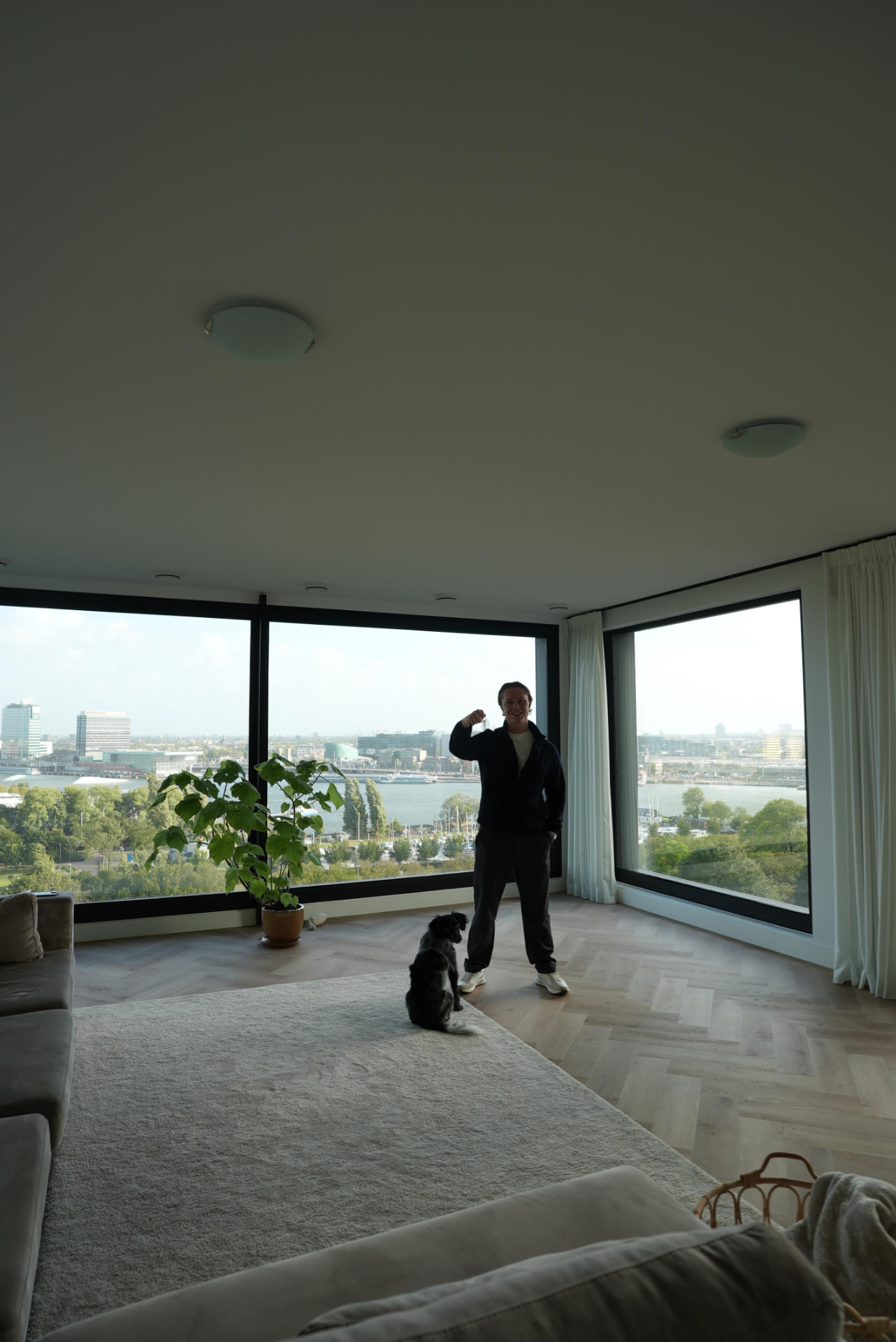 Bram at home in Amsterdam with his dog